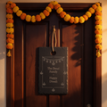 Slate plaque with hanging string engraved The Desai Family Happy Diwali on a front door with marigolds
