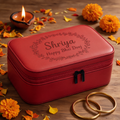 Red leatherette zippered jewelry box engraved Shriya Happy Bhai Dooj with a floral border